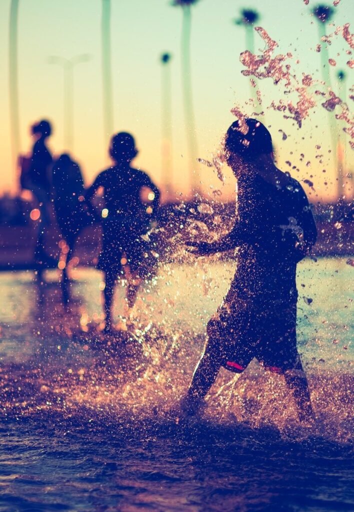 a group of people standing in a body of water