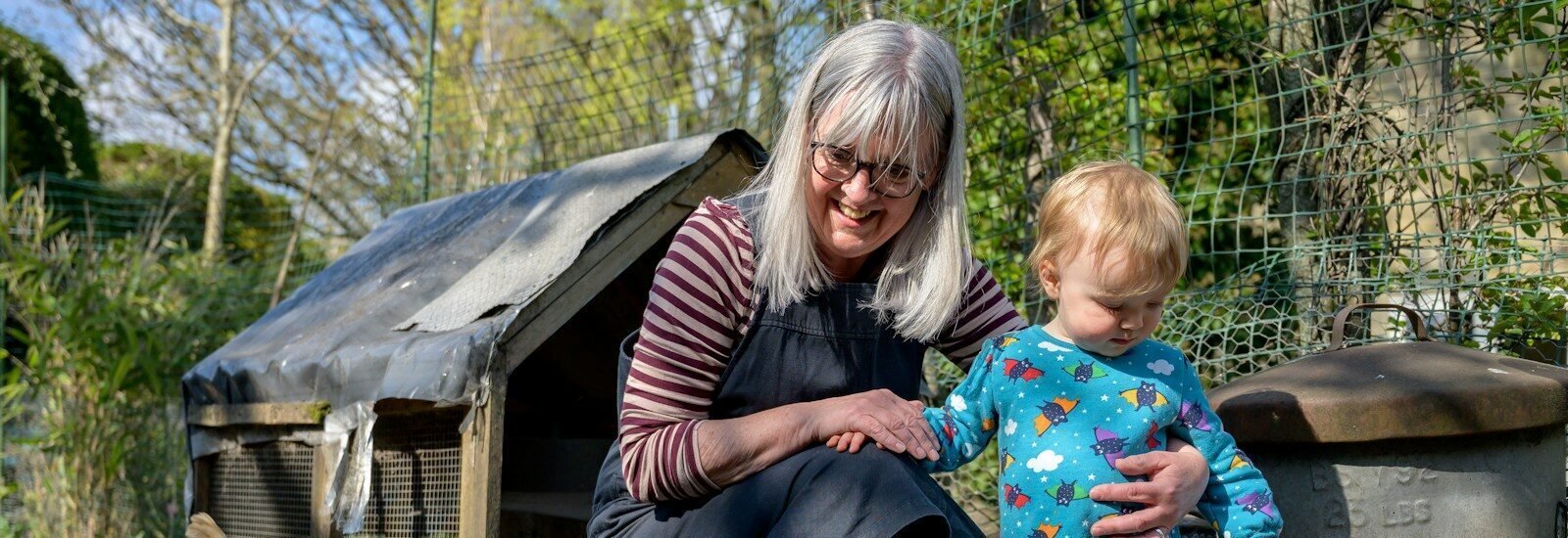 A grandmother spending time outdoors with her granddaughter.